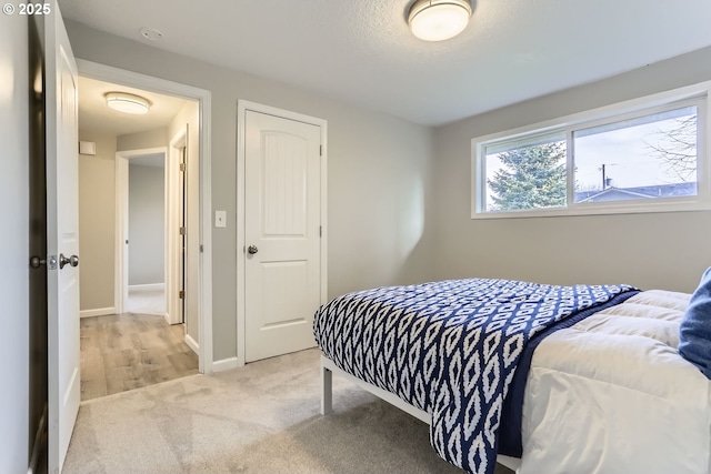 carpeted bedroom with a closet