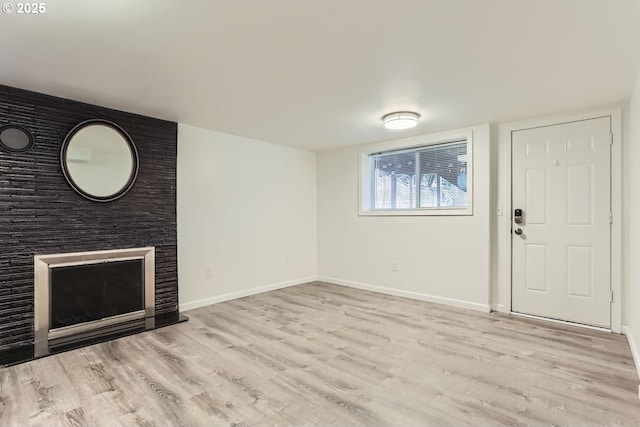 unfurnished living room with light hardwood / wood-style flooring