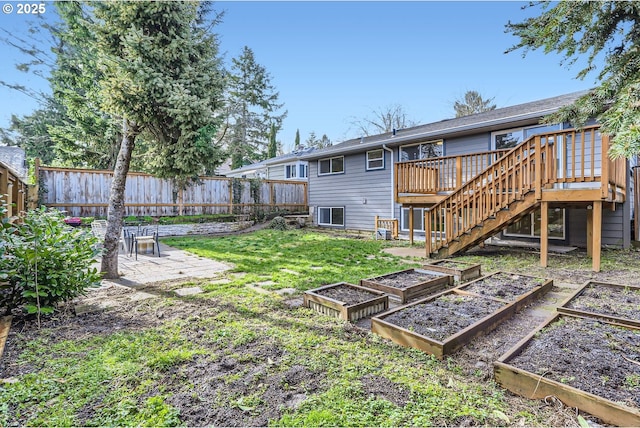 view of yard featuring a deck and a patio area