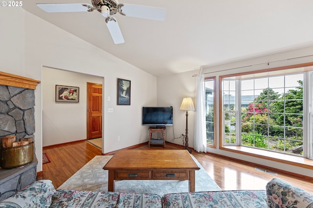 20 Wild Winds St, Florence, OR 97439 - living area featuring vaulted ceiling, wood finished floors, and ceiling fan