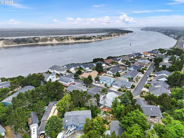 20 Wild Winds St, Florence, OR 97439 - aerial overview of property's location featuring a large body of water and nearby suburban area