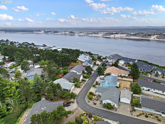 20 Wild Winds St, Florence, OR 97439 - aerial view of property and surrounding area featuring a nearby body of water and nearby suburban area