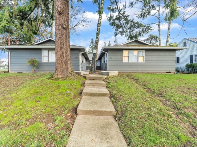 view of front of property with a front lawn