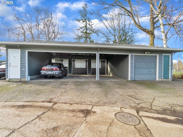 garage featuring a carport