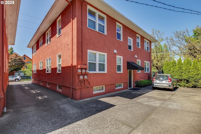 1534 NE 26th Ave Unit 8, Portland, OR 97232 - view of home's exterior with stucco siding