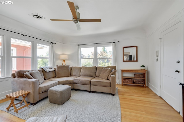 1534 NE 26th Ave Unit 8, Portland, OR 97232 - living area with light wood-style floors and a ceiling fan