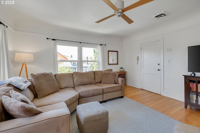 1534 NE 26th Ave Unit 8, Portland, OR 97232 - living area with a ceiling fan, light wood-type flooring, and baseboards