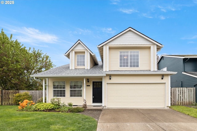 traditional home with fence, a front lawn, concrete driveway, an attached garage, and a shingled roof