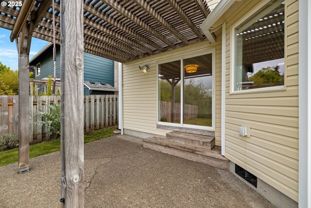 view of patio / terrace with fence, a pergola, and entry steps