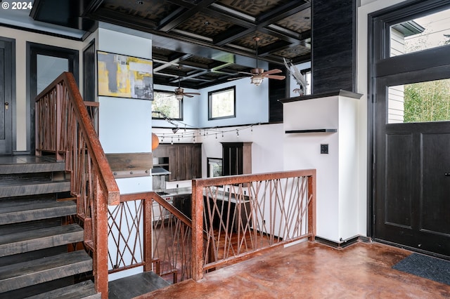 interior space featuring concrete floors and ceiling fan