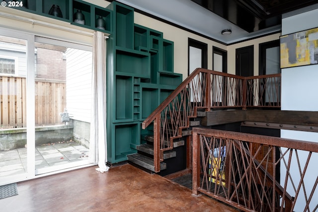 stairs featuring concrete floors