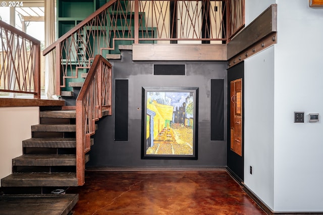 stairway with concrete floors