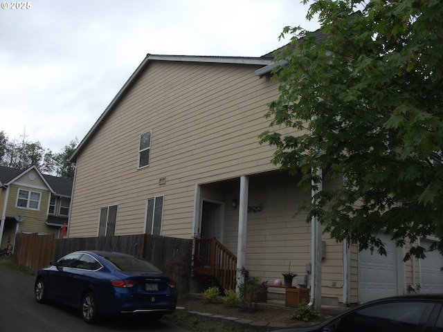 35087 Roberts Ln, Saint Helens, OR 97051 - view of side of home featuring fence and a garage
