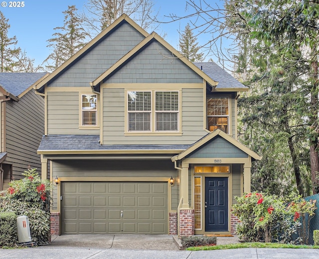 craftsman-style house with driveway, brick siding, roof with shingles, and an attached garage