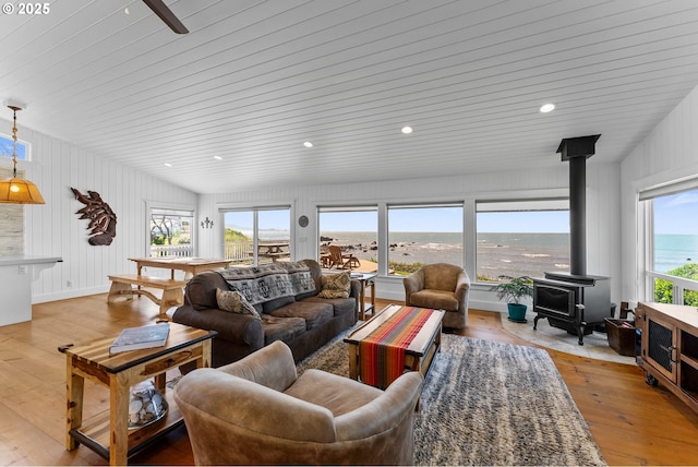 15436 Oceanview Dr, Brookings, OR 97415 - living area featuring a wood stove and light wood-style flooring