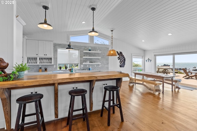 15436 Oceanview Dr, Brookings, OR 97415 - kitchen featuring vaulted ceiling, butcher block counters, a kitchen breakfast bar, and wooden ceiling