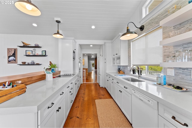 15436 Oceanview Dr, Brookings, OR 97415 - kitchen featuring light countertops, a sink, and dishwasher