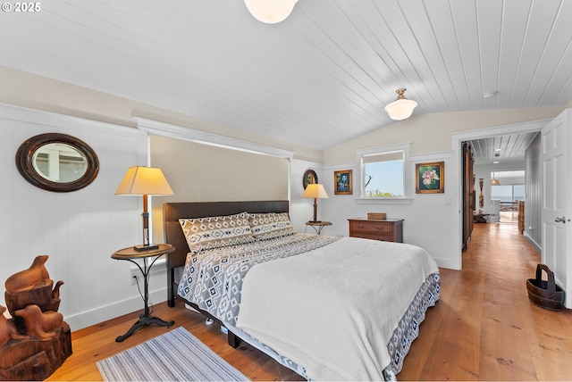 15436 Oceanview Dr, Brookings, OR 97415 - bedroom featuring vaulted ceiling, hardwood / wood-style flooring, baseboards, and wooden ceiling