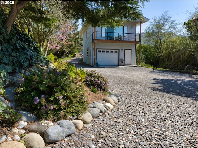 15436 Oceanview Dr, Brookings, OR 97415 - view of side of property featuring an attached garage and gravel driveway