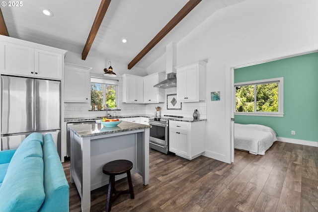 15436 Oceanview Dr, Brookings, OR 97415 - kitchen with white cabinets, stone countertops, appliances with stainless steel finishes, and tasteful backsplash