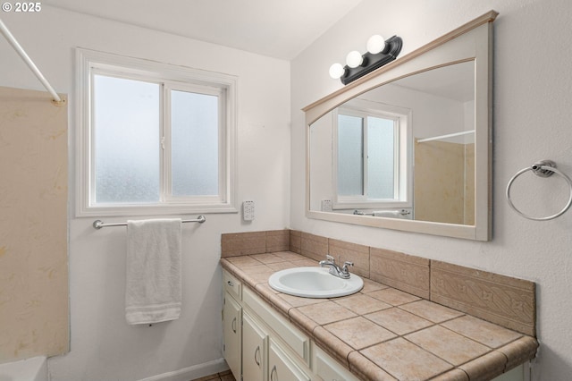 bathroom with vanity and plenty of natural light