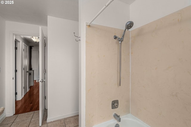 bathroom with tile patterned floors and shower / bathtub combination