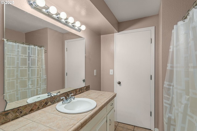 bathroom featuring vanity and tile patterned flooring