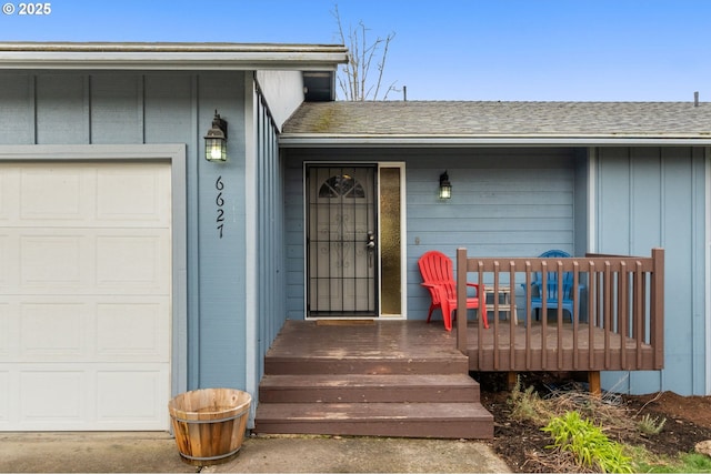 view of exterior entry featuring a garage