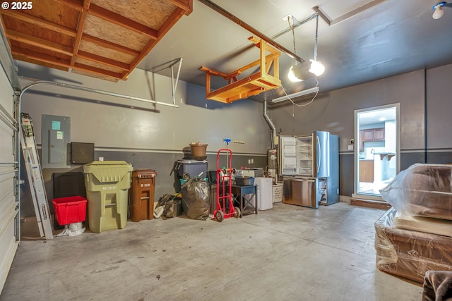 garage featuring electric panel and a garage door opener