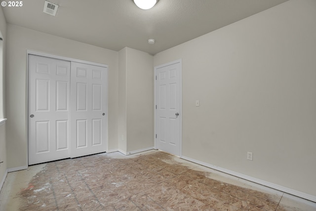 unfurnished bedroom with a closet