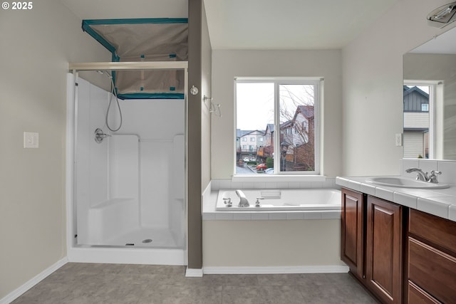 bathroom featuring separate shower and tub and vanity