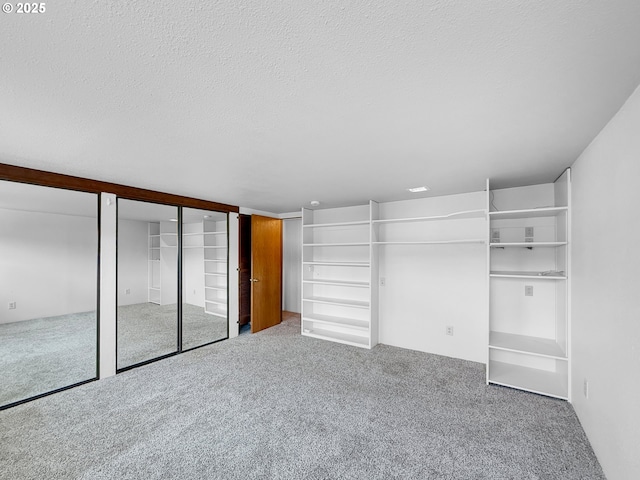 55 Irving St, Cathlamet, WA 98612 - unfurnished bedroom featuring multiple closets, carpet flooring, and a textured ceiling