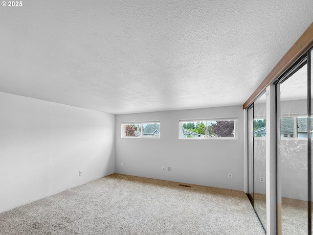 55 Irving St, Cathlamet, WA 98612 - spare room with carpet and a textured ceiling