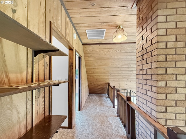 55 Irving St, Cathlamet, WA 98612 - corridor featuring light carpet, wood walls, and an upstairs landing
