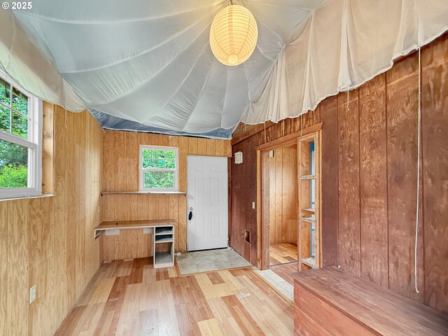 55 Irving St, Cathlamet, WA 98612 - misc room with wood walls and light wood-type flooring