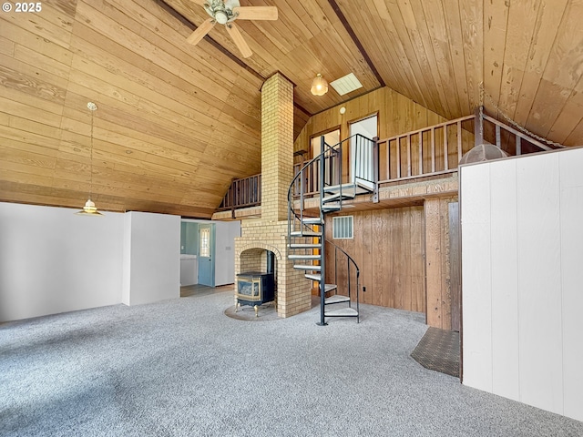55 Irving St, Cathlamet, WA 98612 - unfurnished living room featuring ceiling fan, lofted ceiling, carpet, wooden ceiling, and wooden walls
