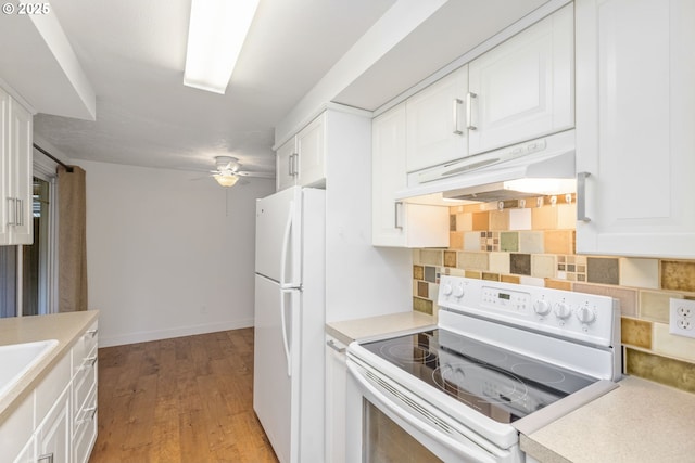 3832 NE 45th St Unit B, Vancouver, WA 98661 - kitchen with white appliances, under cabinet range hood, a ceiling fan, backsplash, and white cabinets