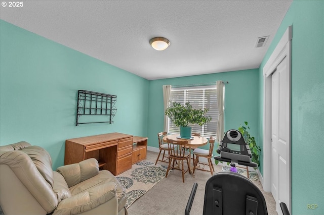 carpeted bedroom with a closet and baseboards