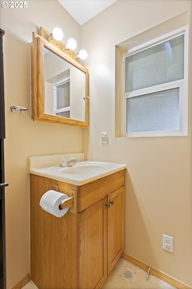 bathroom featuring vanity and baseboards