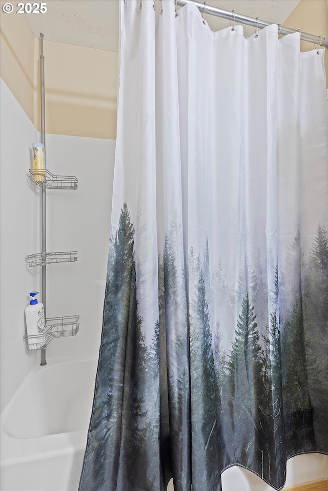 full bath with a shower with shower curtain