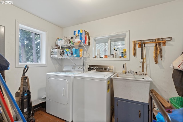 clothes washing area featuring washing machine and dryer and laundry area