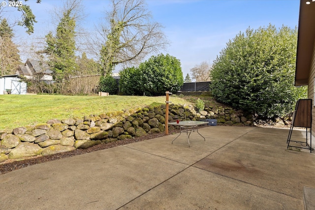 view of patio / terrace featuring fence