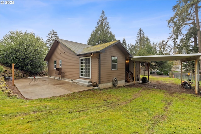 view of home's exterior featuring entry steps, a patio area, a yard, and fence