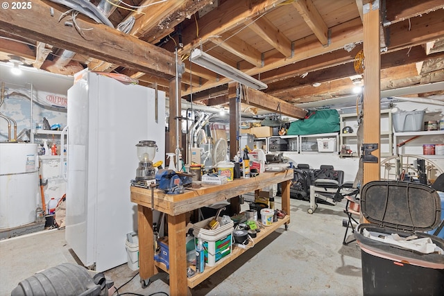 unfinished basement with water heater and a workshop area