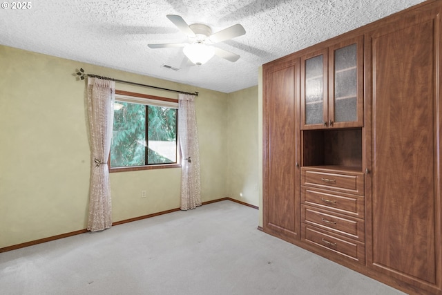 17002 NE 50th Ave, Vancouver, WA 98686 - unfurnished bedroom with carpet flooring, baseboards, a textured ceiling, and a ceiling fan