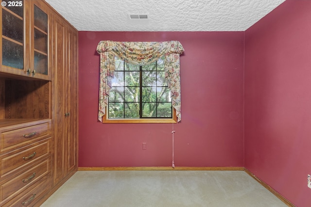 17002 NE 50th Ave, Vancouver, WA 98686 - spare room featuring light carpet, a textured ceiling, and baseboards
