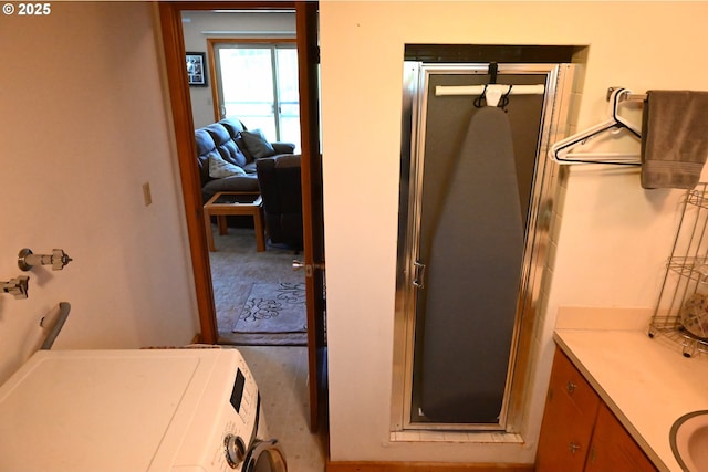 7811 NE 78th St, Vancouver, WA 98662 - bathroom featuring a shower stall, washer / dryer, and vanity
