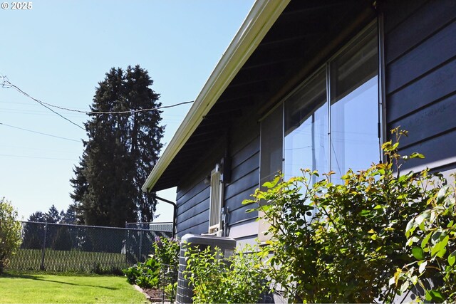7811 NE 78th St, Vancouver, WA 98662 - view of home's exterior featuring central air condition unit, a lawn, and fence