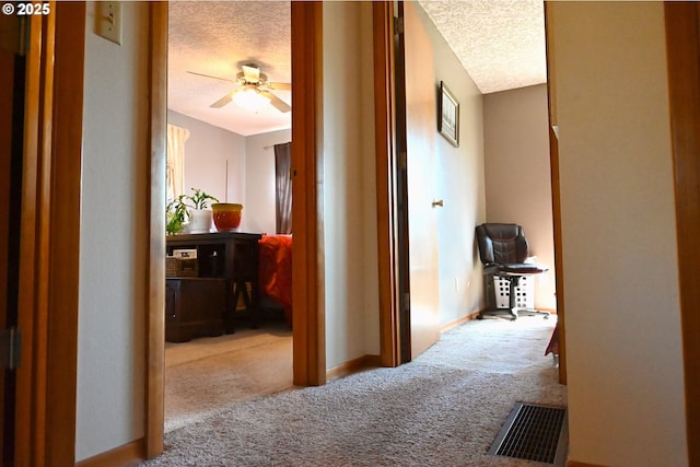 7811 NE 78th St, Vancouver, WA 98662 - hall with carpet floors, a textured ceiling, visible vents, and baseboards