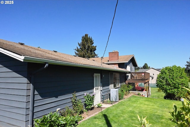 7811 NE 78th St, Vancouver, WA 98662 - view of home's exterior featuring a lawn and central AC unit